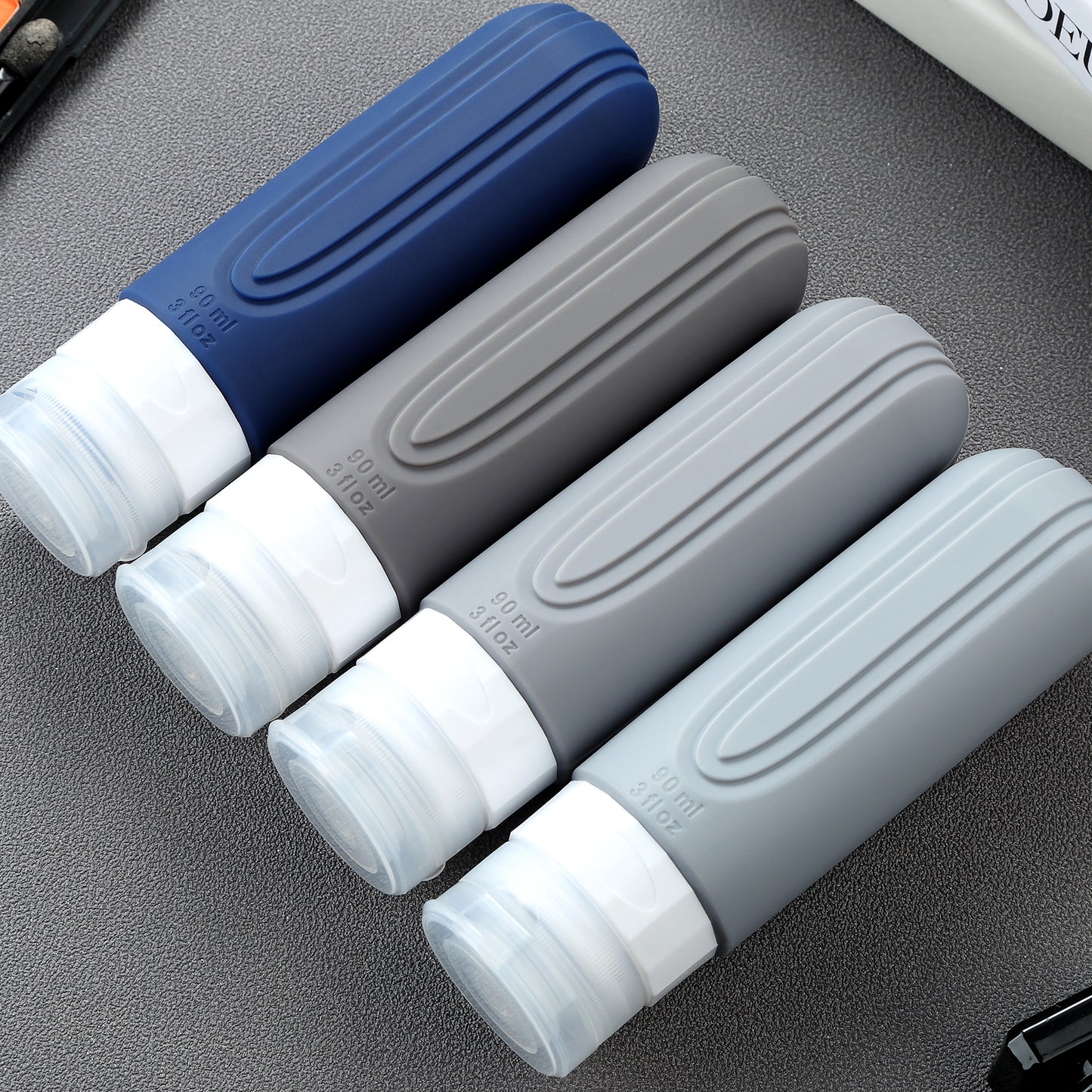 Micebay Leak-Proof 3-oz Silicone Squeezable Travel Bottles for Toiletries, Refillable Travel Size Containers, BPA Free, TSA Approved, Navy-Gray, 4 Pack
